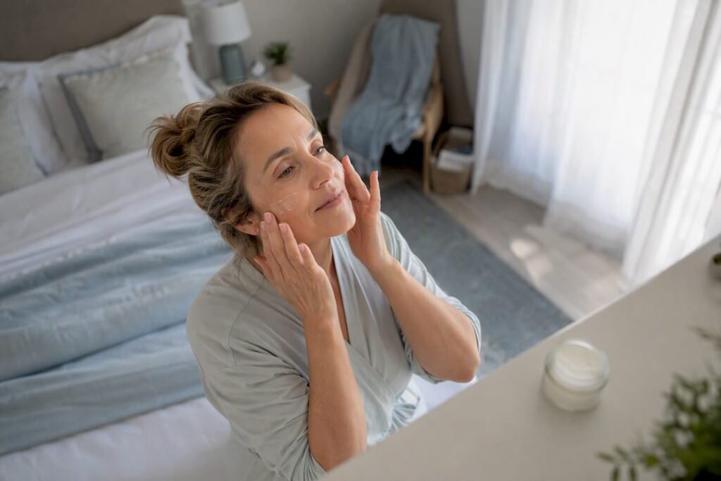 Woman applying winter face moisturizer
