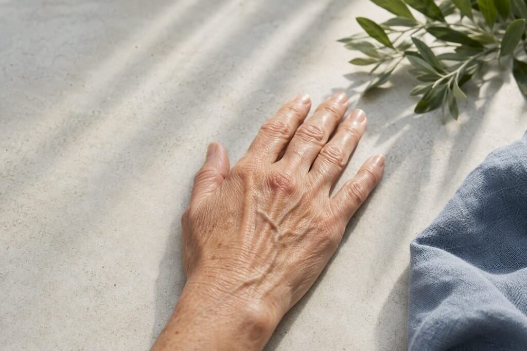 Mature hand showing visible veins and sun spots