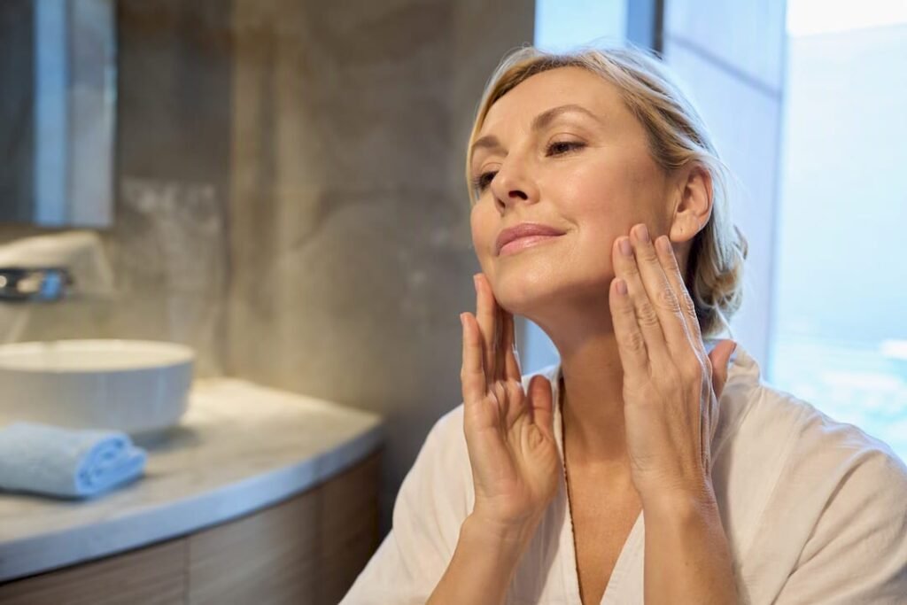 Woman performing a gentle facial massage