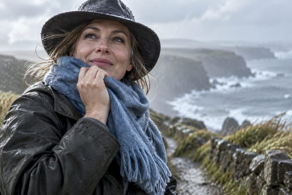 Woman protecting face from Irish wind and rain