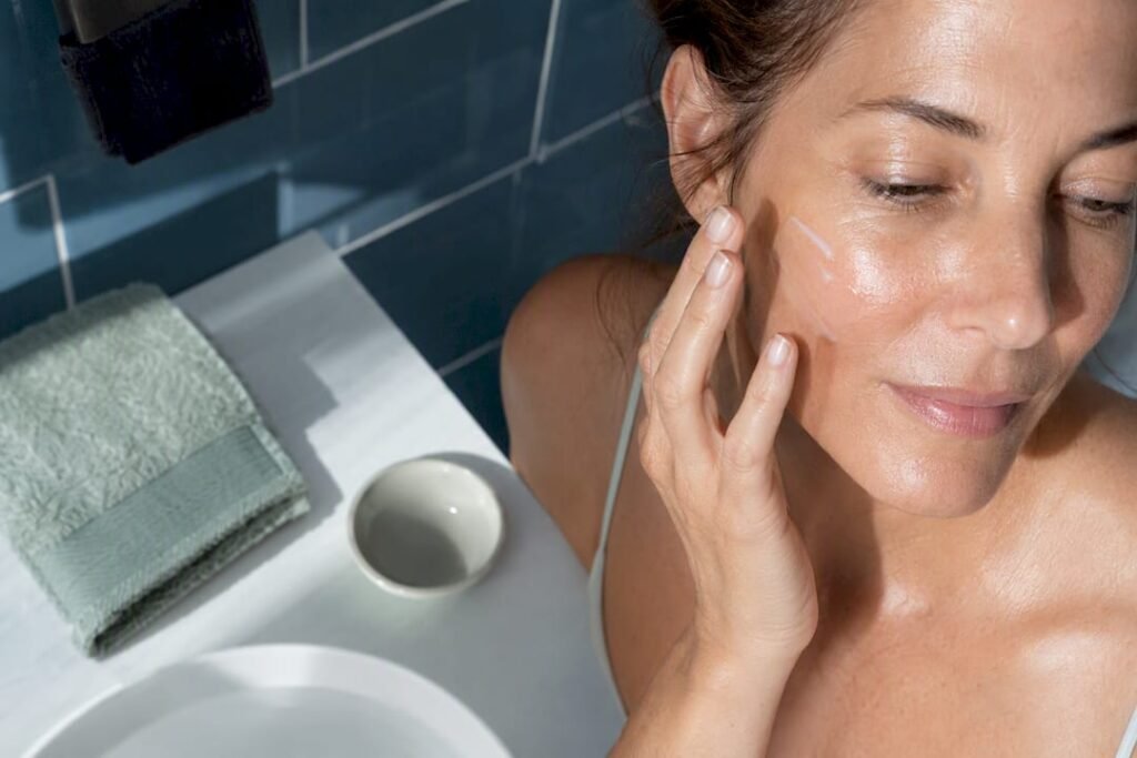 Woman applying moisturiser for brighter skin